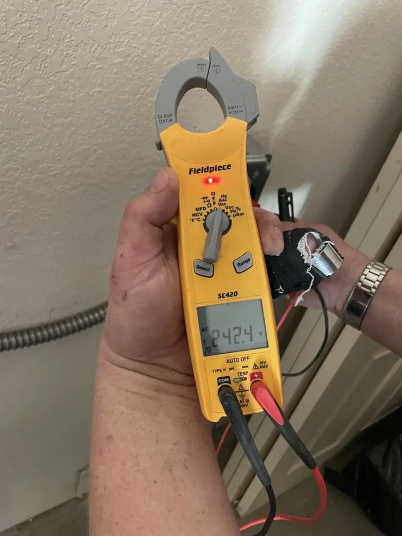Voltage testing with clamp meter during Electrical Installation Services in Coldwater